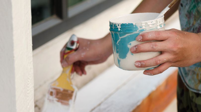 Contractor Painting the Exterior of a Home in Easton, PA